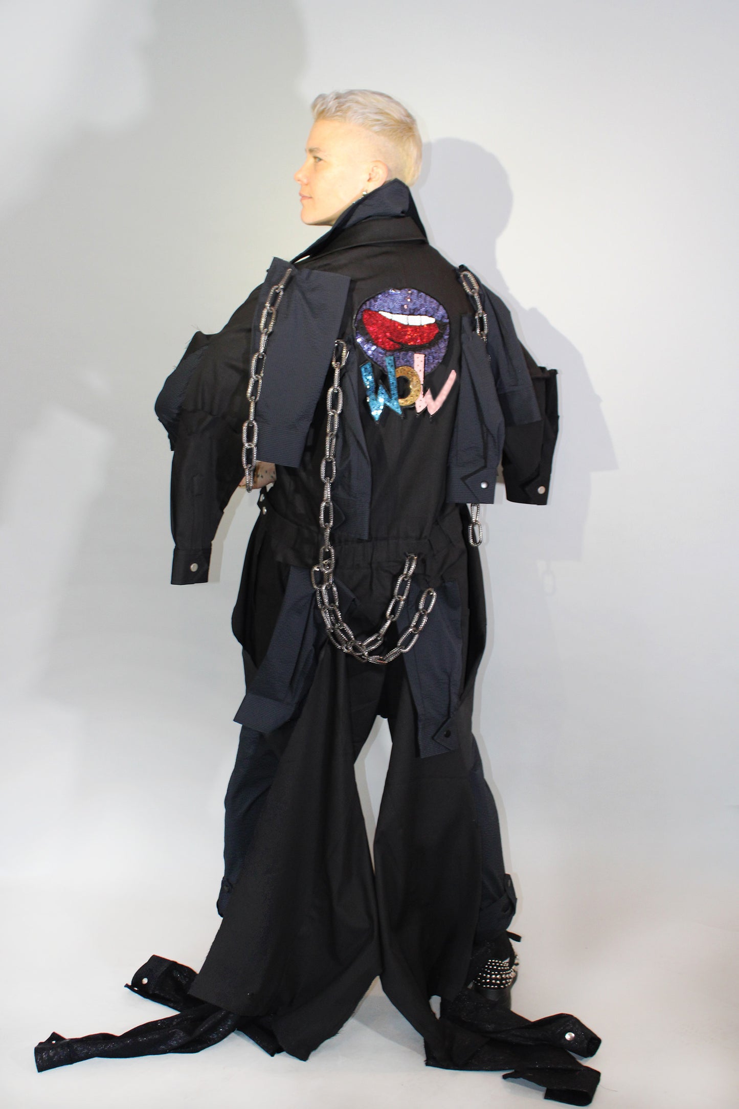 The Feminine WILDE Jumpsuit - Long Sleeve in Black Seersucker with Up-cycled "WOW" Tailcoat